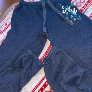 Brand is Aēropostale. The color is deep blue. Haven’t been worn in over a year.